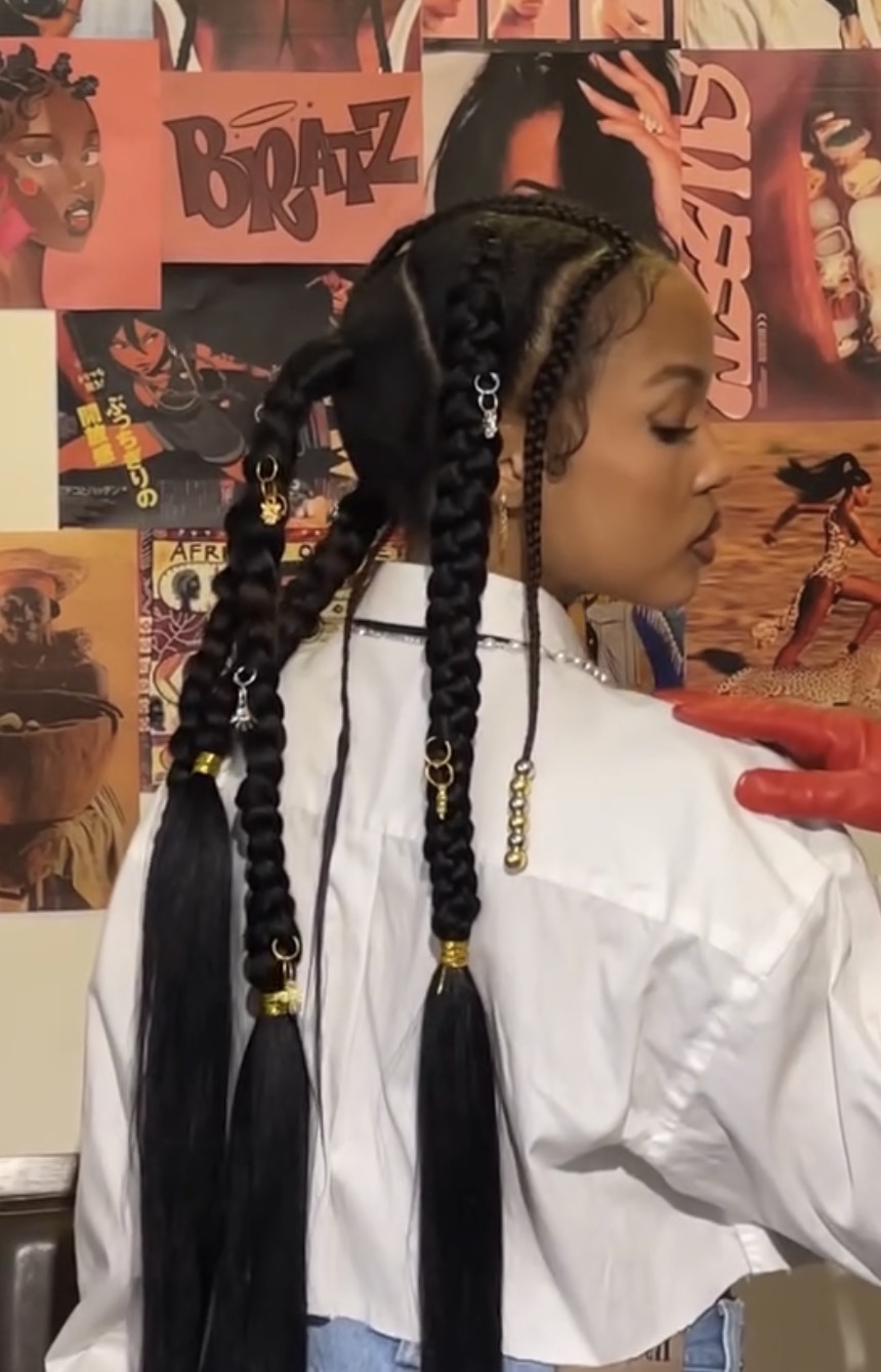 Long fulani-style braids with gold cuffs